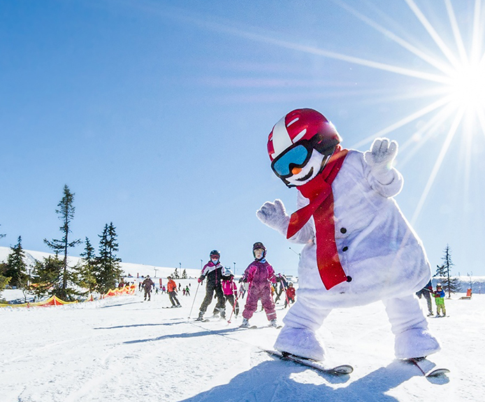 Skiing snowman mascot